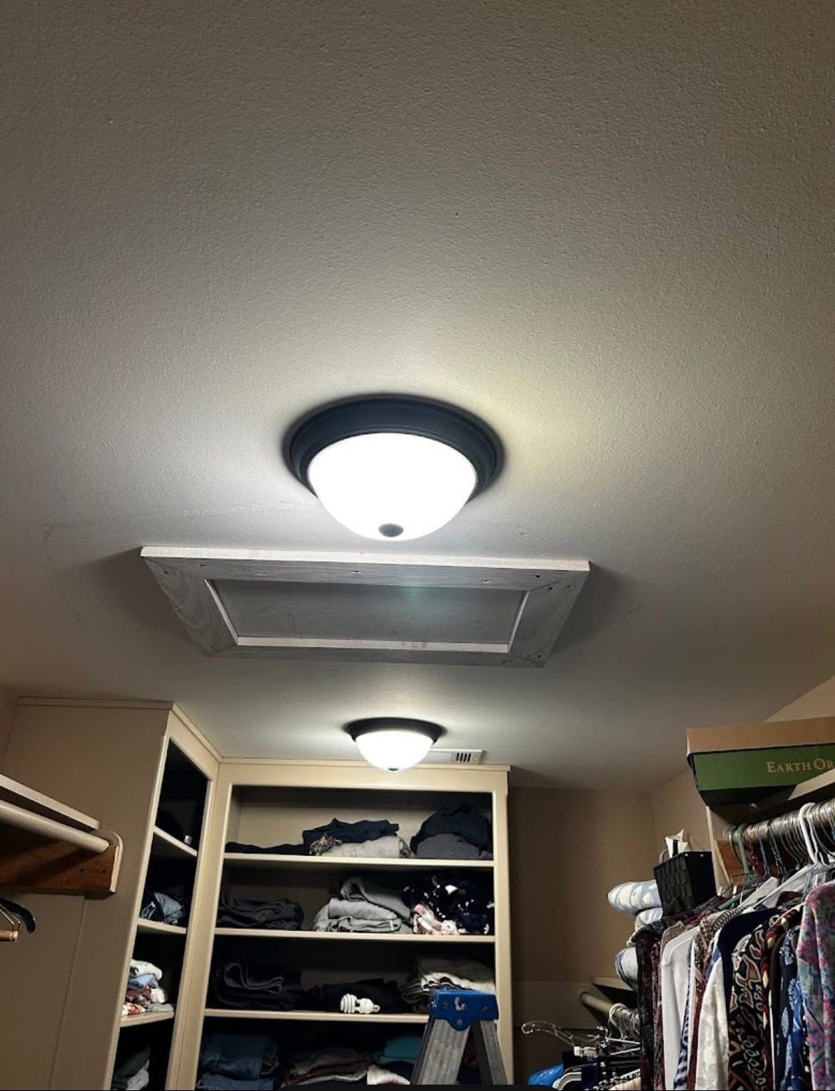New flush-mount light fixtures in a walk-in closet