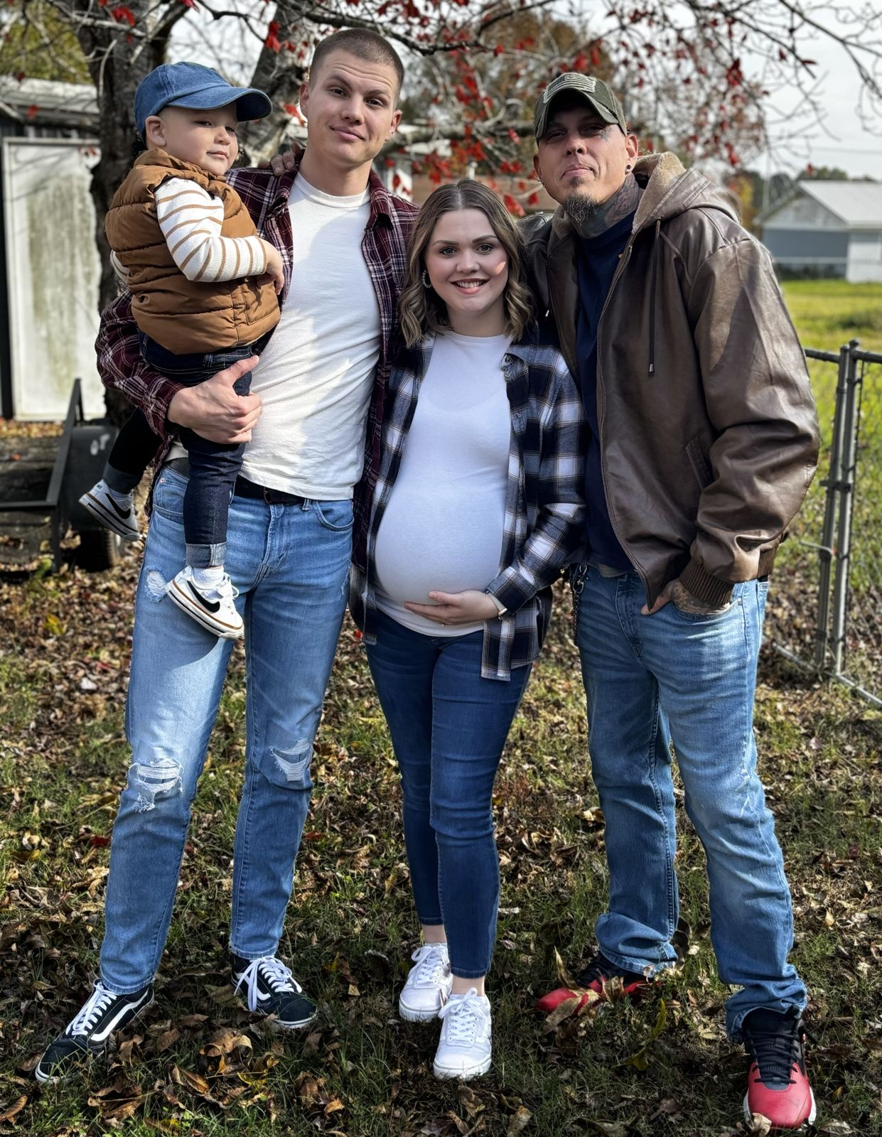 The family behind Mayo's Construction, standing together in a yard